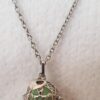 Bola de grossesse argenté – cage tortue, perle d’harmonie verte claire, coeur et chaine inox