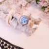 Bague inox artisanal - cabochon floral bleu et blanc Bague inox - cabochon floral bleu et blanc