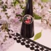Bague inox - cabochon fleurs roses et feuillage sur fond noir