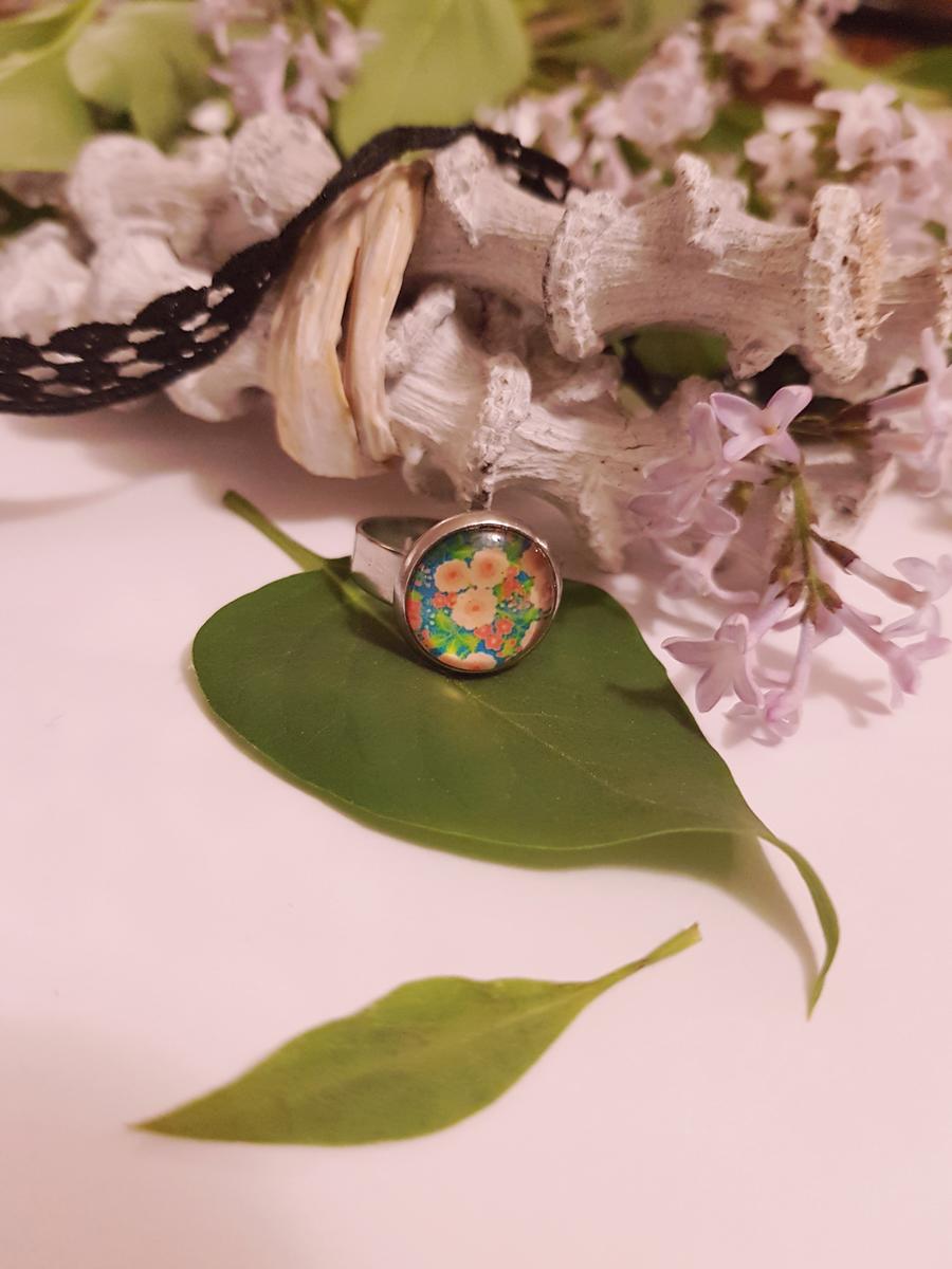 Bague inox - cabochon floral orangé et feuillage vert