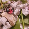 Bague inox - cabochon fleurs roses et feuillage sur fond noir