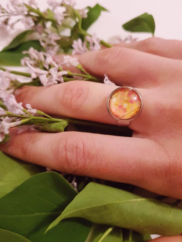 Bague inox - cabochon floral jaune et orangé
