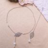 Collier et bijou de dos inox mariage fait main - Feuilles et perles blanches. Calino Crea Collier et bijou de dos inox mariage fait main - Feuilles et perles blanches. Calino Crea