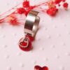 Bague inox artisanale - Sequin rouge et petit coeur argenté. Calino Créa