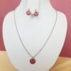 Collier inox artisanal - Sequin rouge et petit coeur argenté. Calino Créa